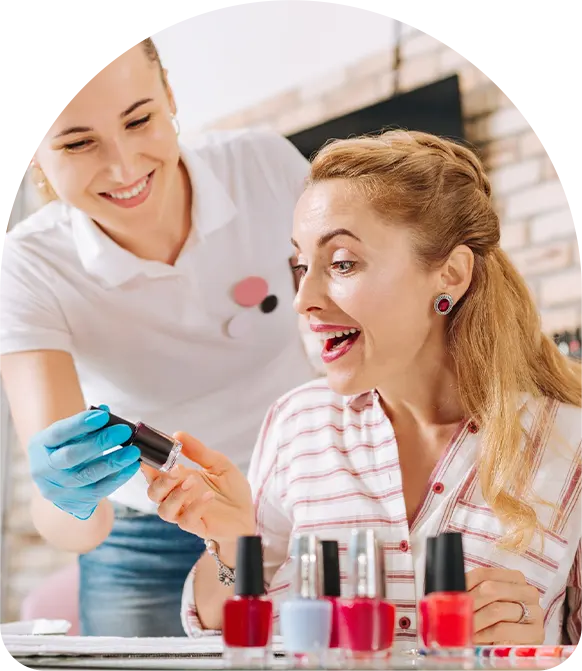 Exuberant mature woman looking at nail polish